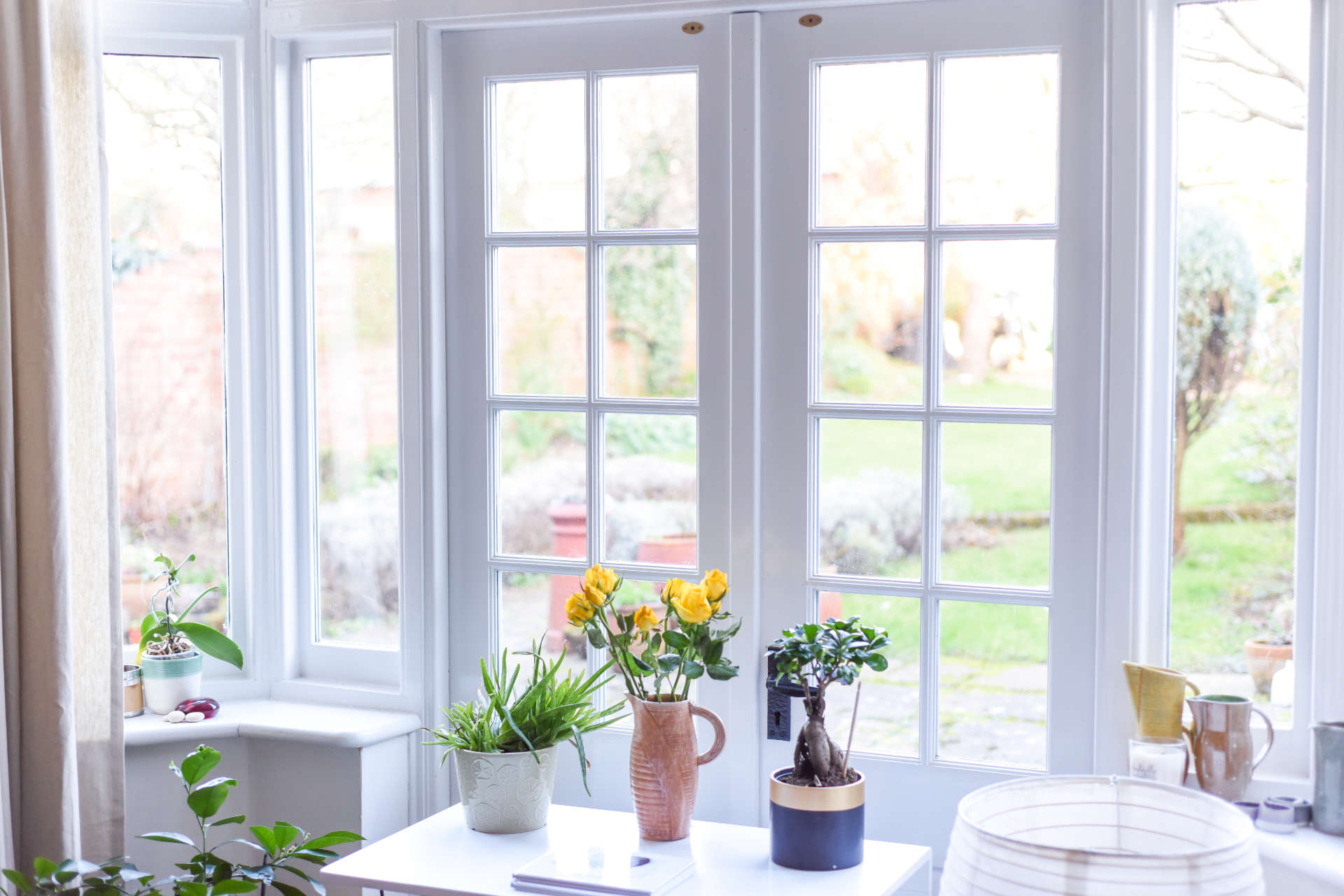 Stylish room interior with bespoke front doors London and light neutral colour